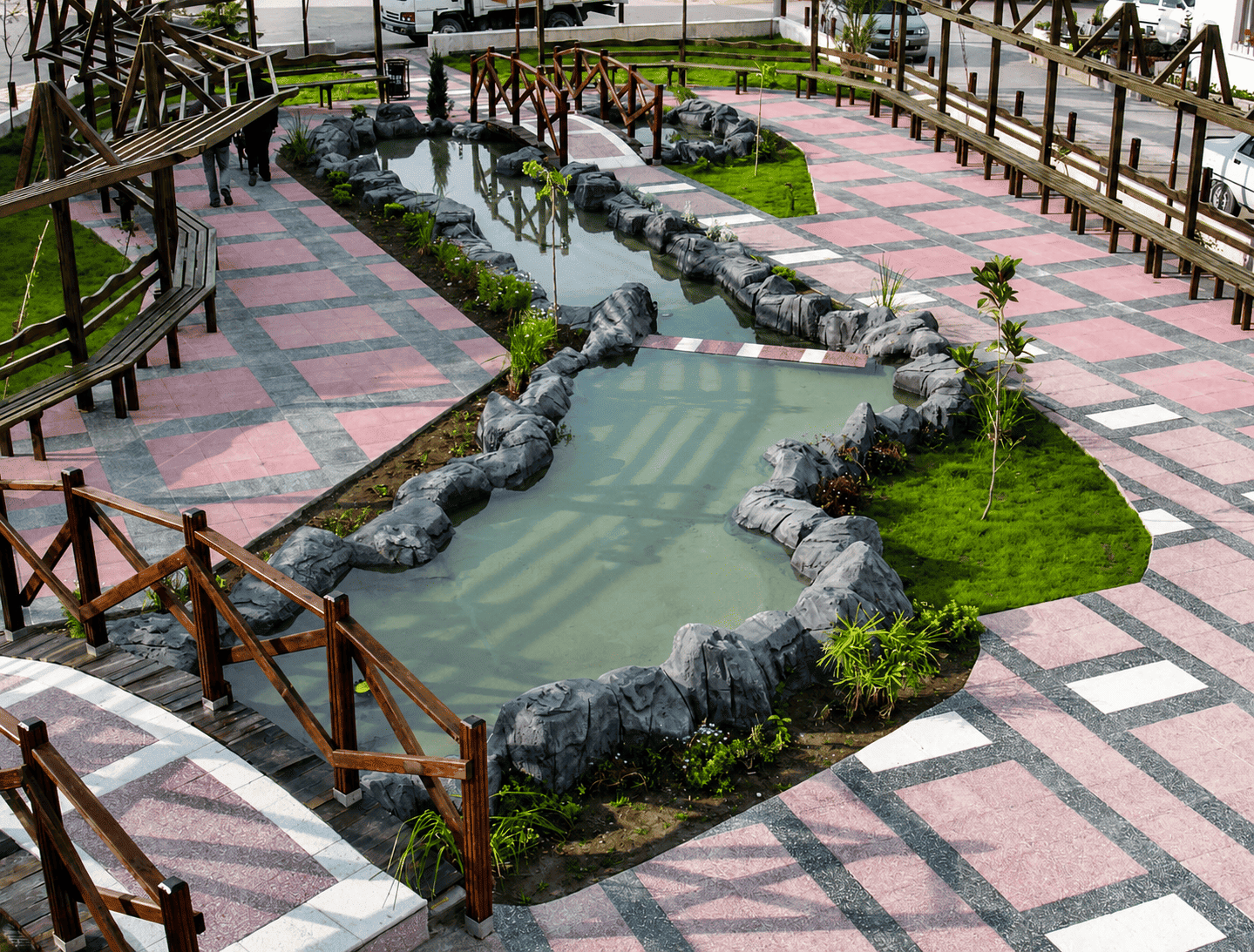 Exterior washbeton terrazzo tiles application - water feature and walkway
